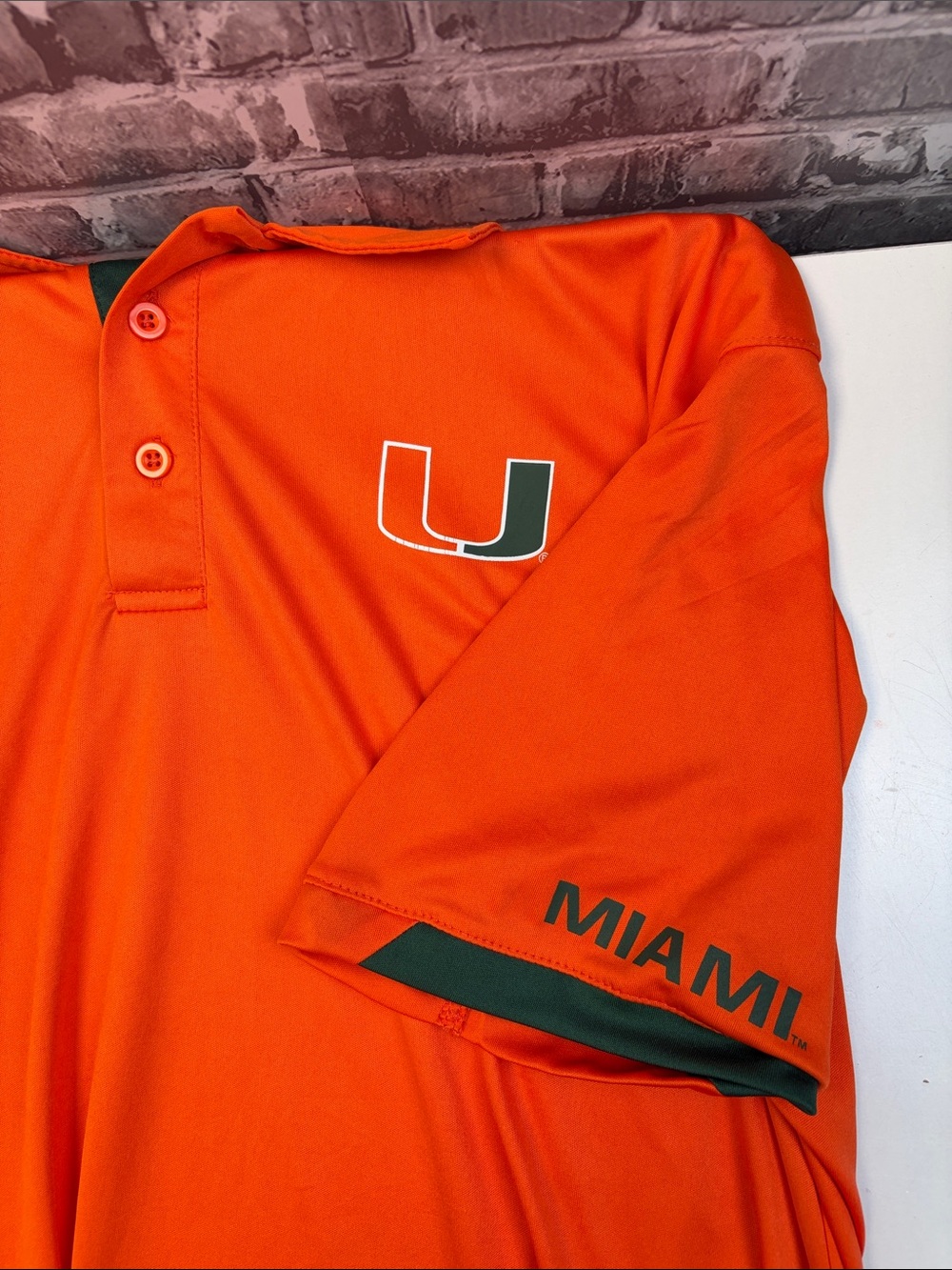 Miami Hurricanes 
Colosseum Orange Men's Polo with Dark‎ Gray trim